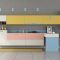 Colorful minimalist kitchen with peninsula