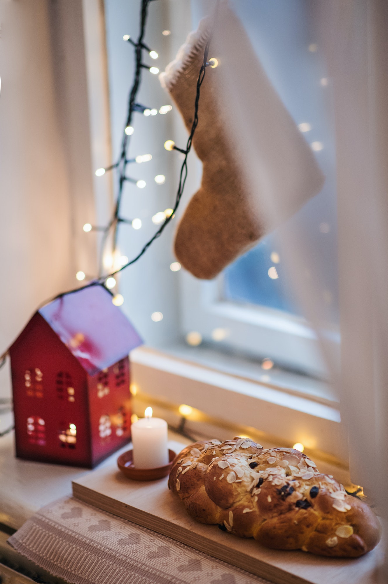 Composition of Christmas decorations indoors on window sill