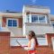 inspector or architect professional woman checking house at construction site. Home improvement