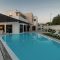 Modern house with garden swimming pool and wooden pergula