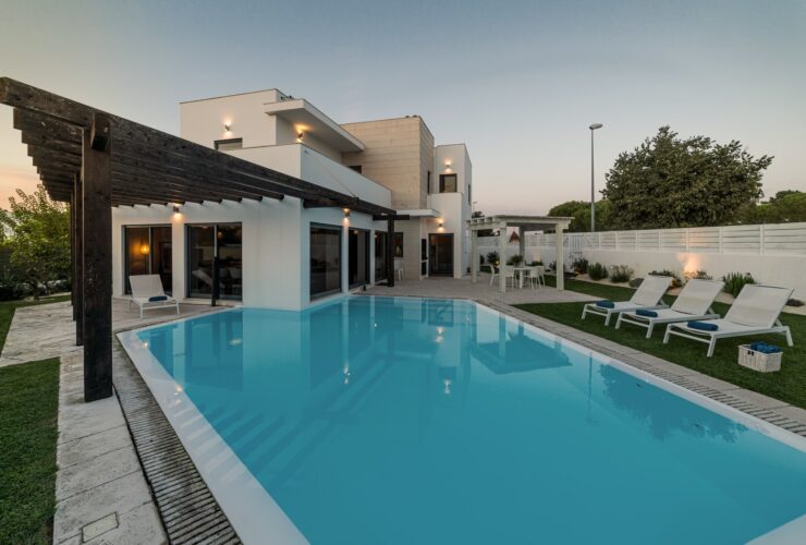 Modern house with garden swimming pool and wooden pergula