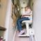 Senior woman using automatic stairlift on a staircase at her home. Medical Stairlift for disabled
