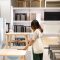 Young woman choosing furniture in a modern home furnishings store