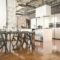 3d rendering industrial style kitchen with black wood dining zone