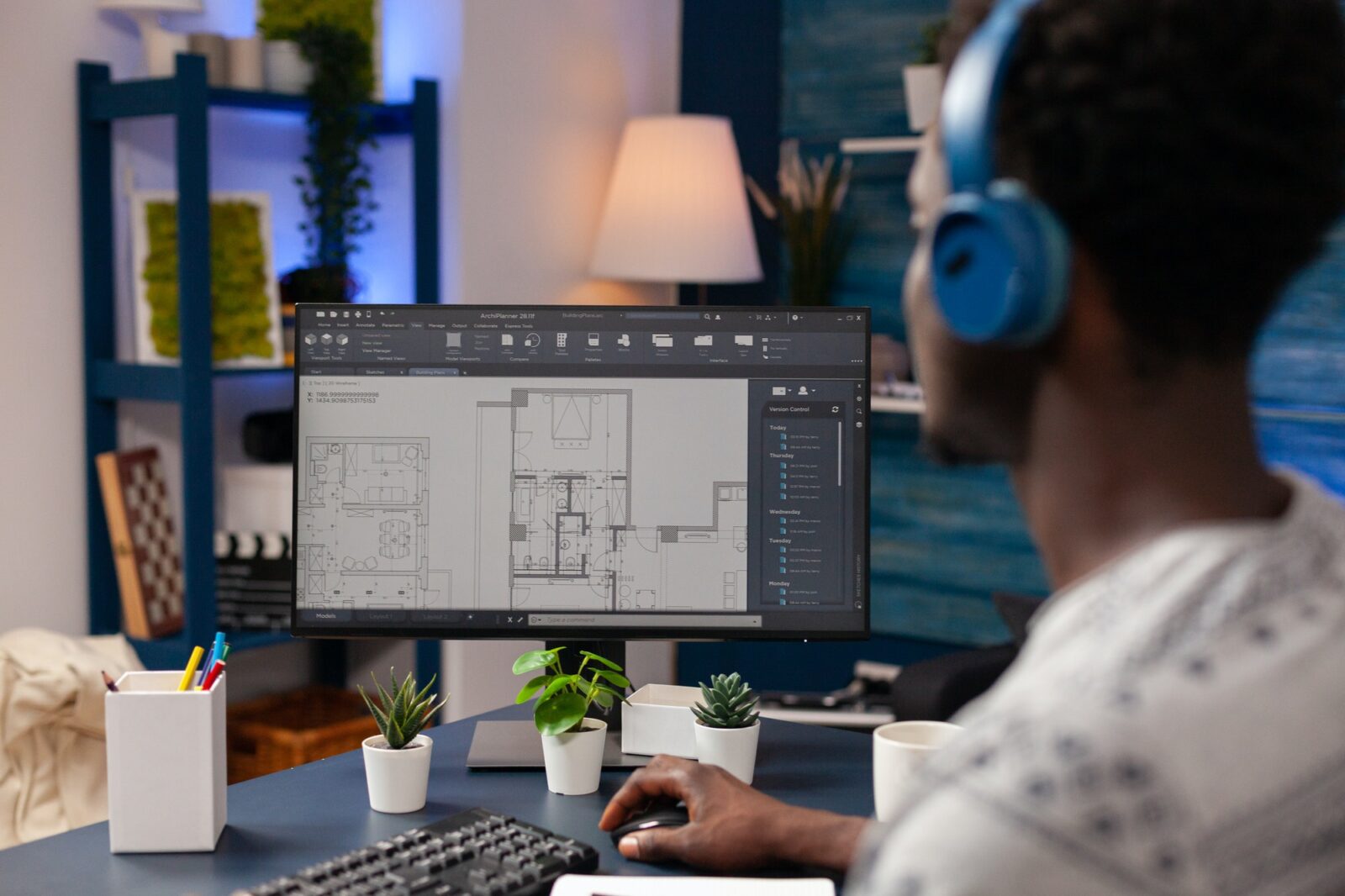 African american architect worker sitting at desk in living room