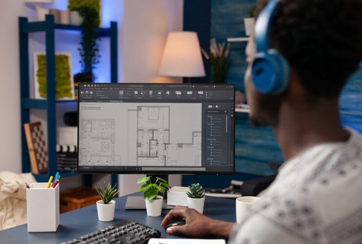 African american architect worker sitting at desk in living room