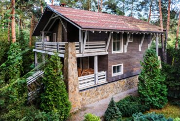 architecture of modern cottage house and green trees
