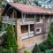 architecture of modern cottage house and green trees