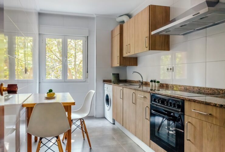 Kitchen interior with furniture and appliances