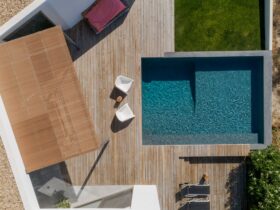 Modern house with garden swimming pool and wooden deck