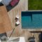 Modern house with garden swimming pool and wooden deck
