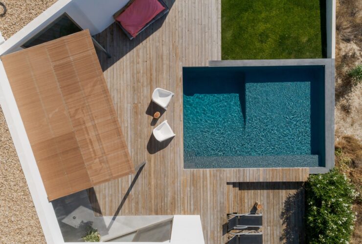 Modern house with garden swimming pool and wooden deck