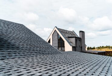 selective focus of building with windows near rooftop