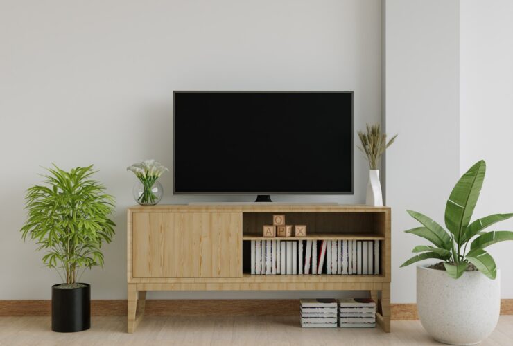 The living room has a storage table and a TV.