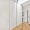 Empty narrow room with storage spaces