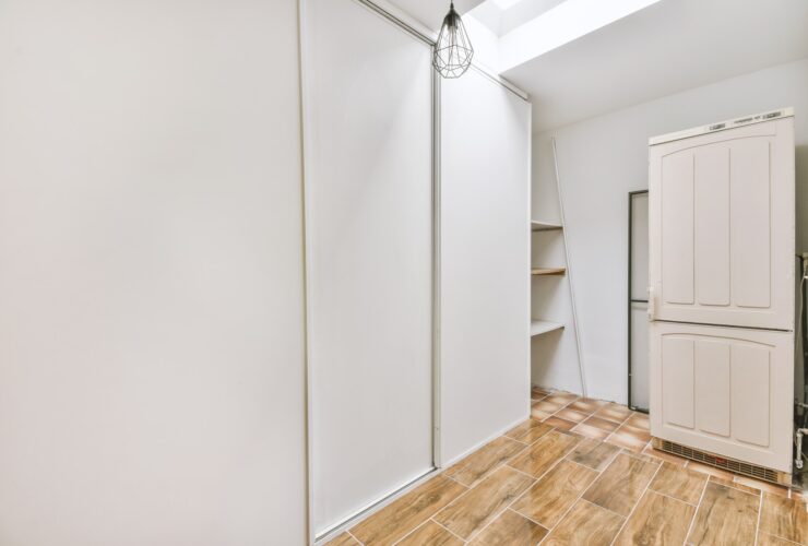 Empty narrow room with storage spaces