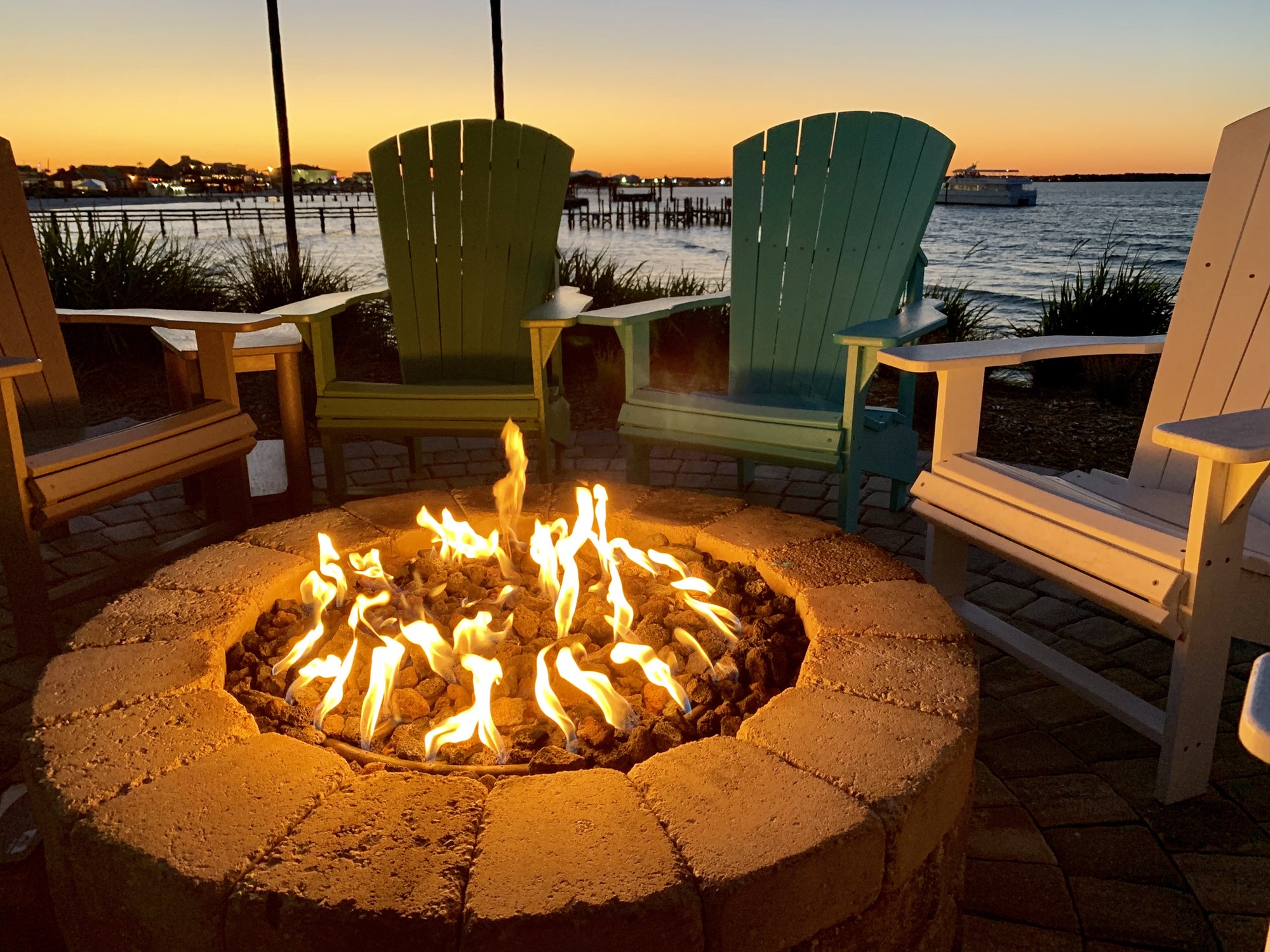 Fire pit by the bay at sunset