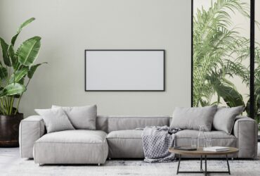 horizontal picture frame in living room interior mock up in gray tones with tropical palm