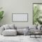 horizontal picture frame in living room interior mock up in gray tones with tropical palm