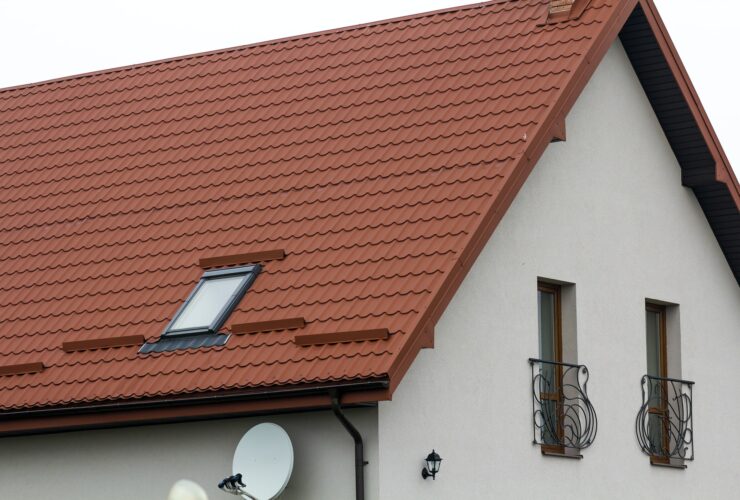 Roof of a new house made from yellow roofing tiles
