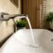 Water running from the crane into the sink