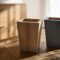 Wooden tall flower pots in natural wooden interior with natural wood furniture and oak floor