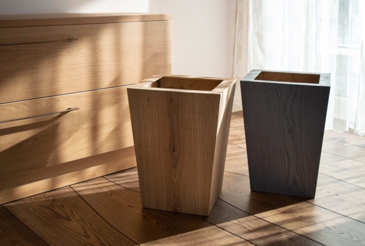 Wooden tall flower pots in natural wooden interior with natural wood furniture and oak floor