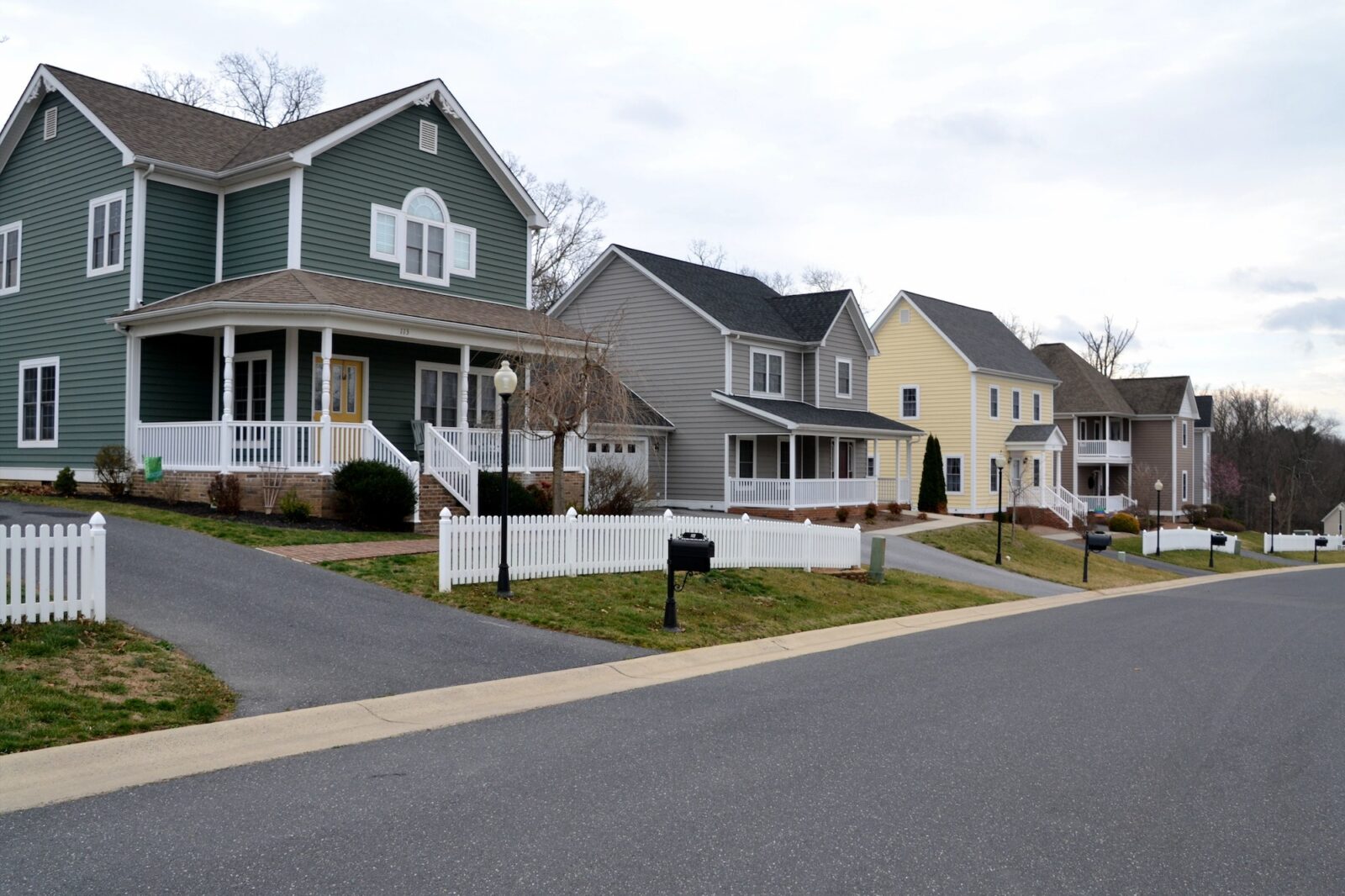 A street of modern homes houses in various colors to make a cozy neighborhood of prime real estate