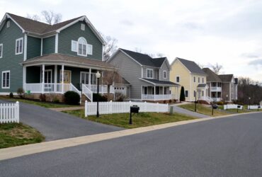 A street of modern homes houses in various colors to make a cozy neighborhood of prime real estate