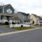 A street of modern homes houses in various colors to make a cozy neighborhood of prime real estate