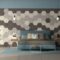 Blue sofa in front of a wall with hexagonal wooden tiles