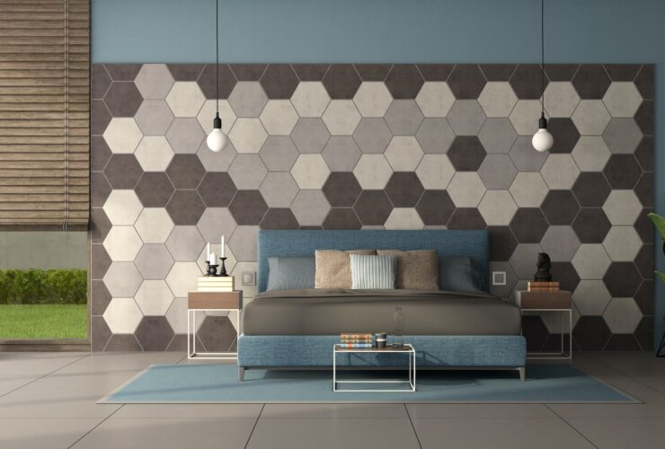 Blue sofa in front of a wall with hexagonal wooden tiles