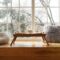 Large window with a window sill with hot tea and cups. The concept of rest and relaxation