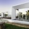 Modern house with garden swimming pool and wooden deck