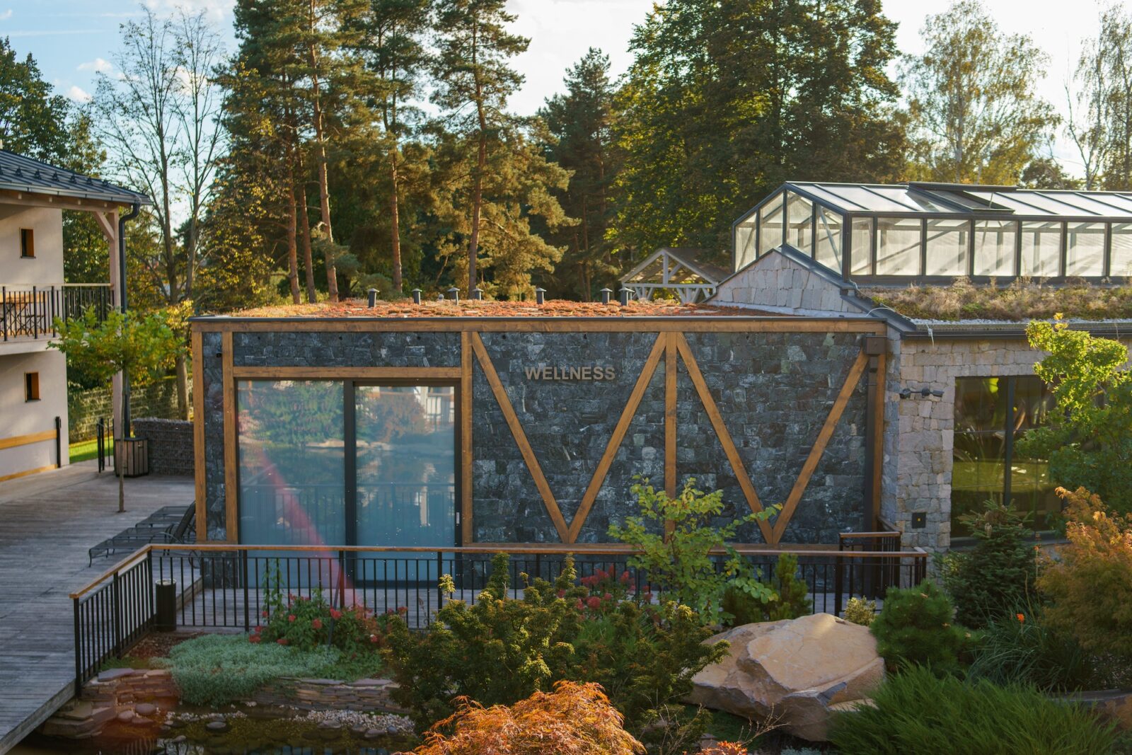 Modern wellness building exterior in luxury hotel garden