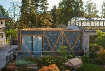 Modern wellness building exterior in luxury hotel garden