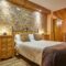 Rustic style bedroom indoor. Wood and stone decoration. Nobody