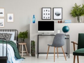 Branches of spruce in glass vases in classy bedroom and workspac