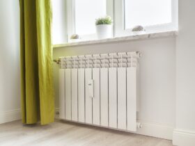 Heating white radiator radiator in living room.