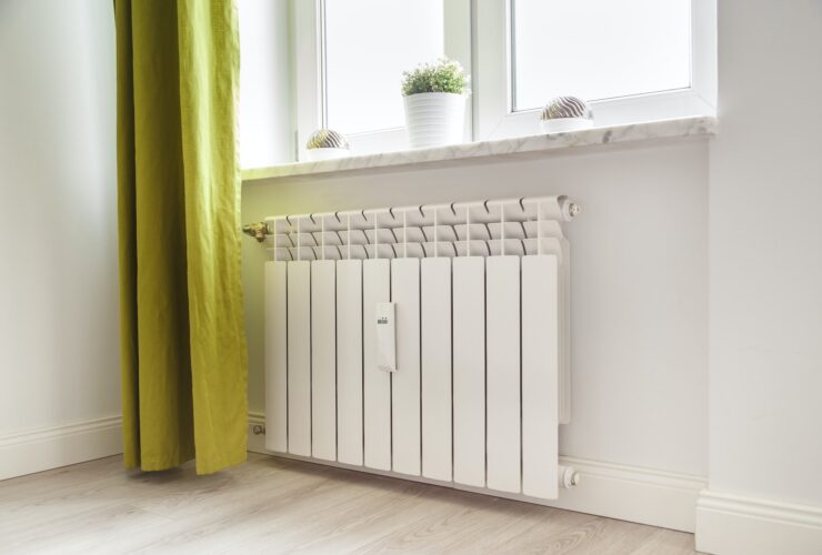 Heating white radiator radiator in living room.