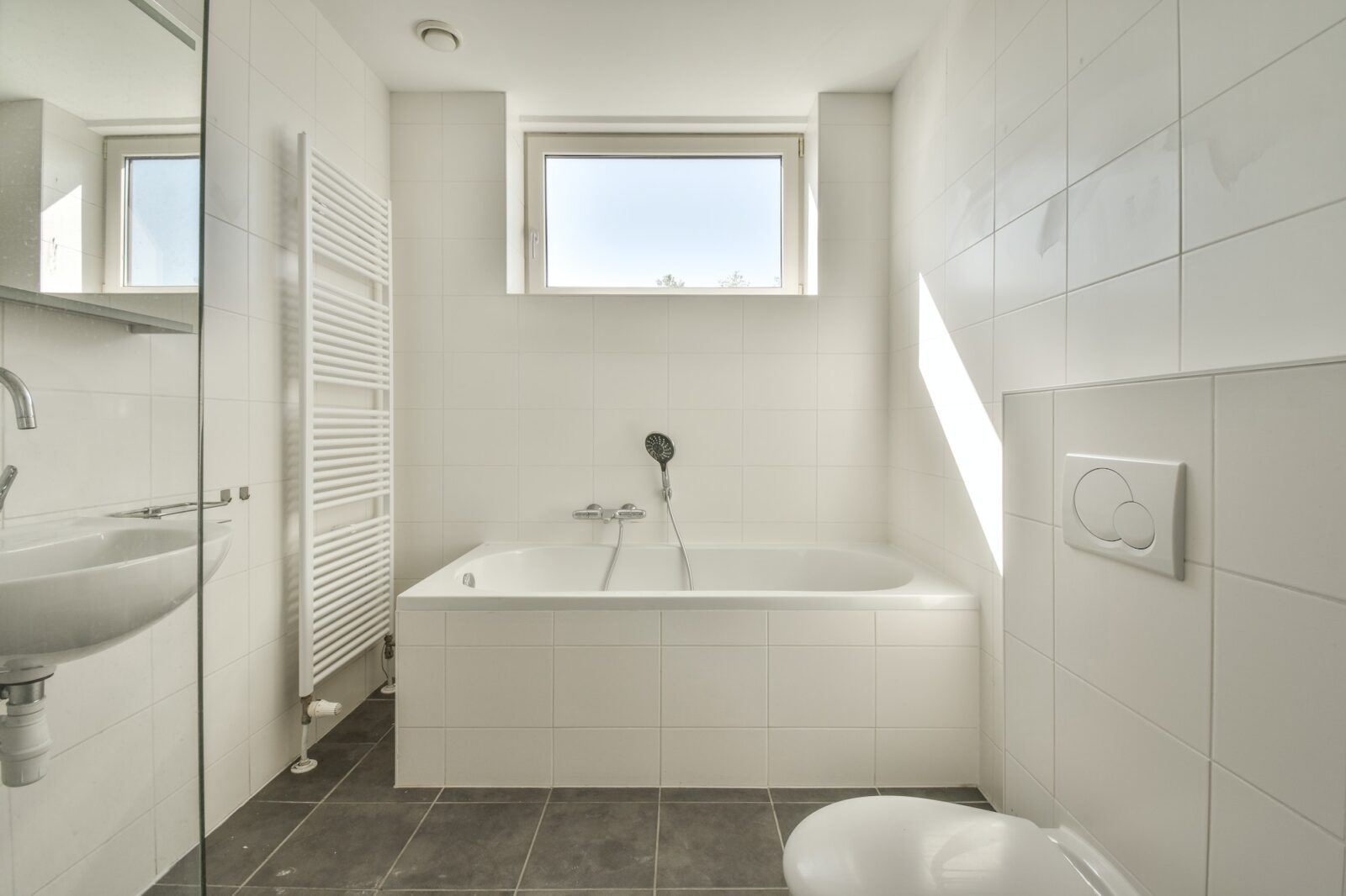 Interior of modern restroom with bathtub