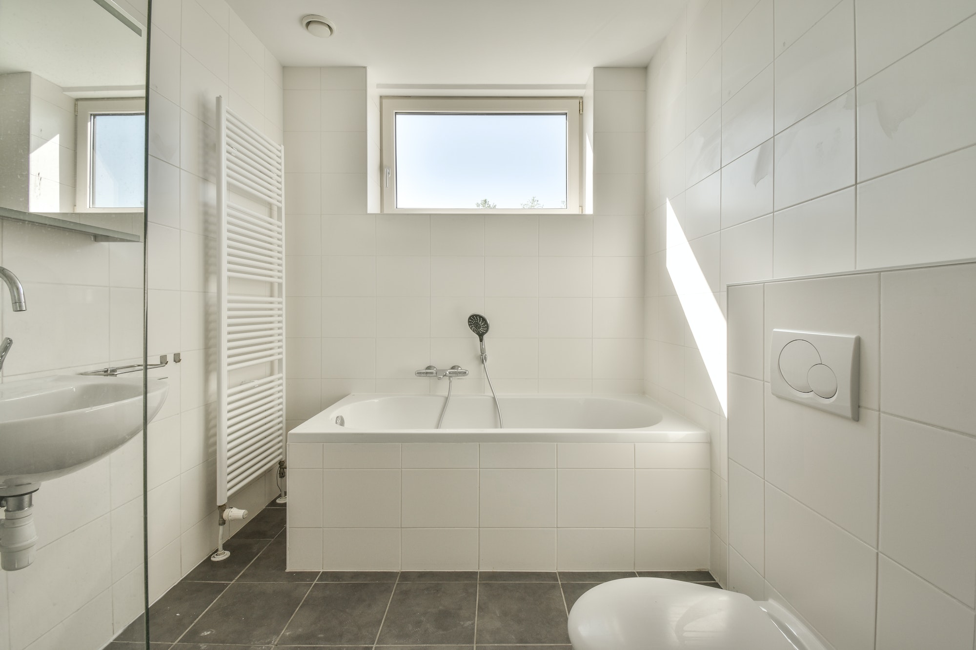 Interior of modern restroom with bathtub