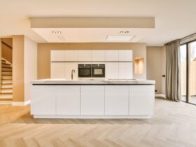 A minimalist kitchen with a block system in white design