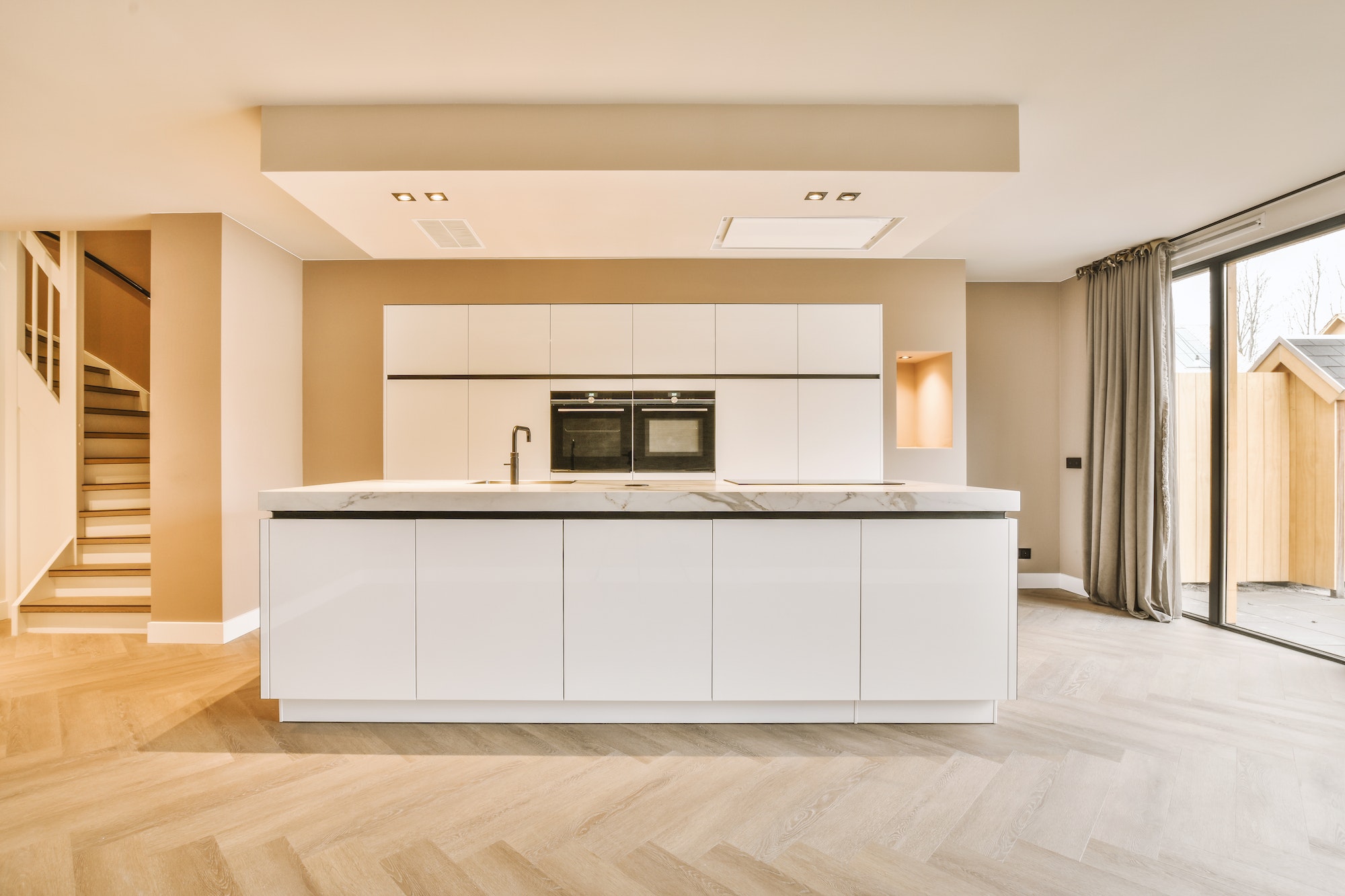 A minimalist kitchen with a block system in white design