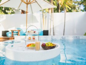 Breakfast and afternoon tea set floating around swimming pool