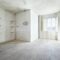 Empty, dirty room in old house, white walls