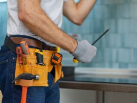 Expert. Cropped shot of young repairman, professional plumber holding a screwdriver while fixing a