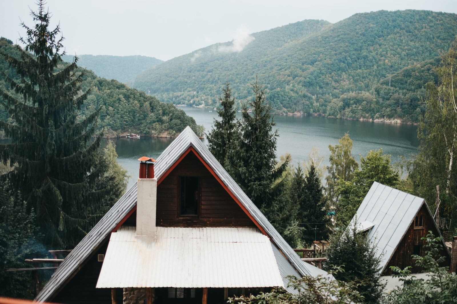 House near amazing lake near mountains