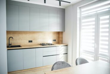 Light modern kitchen interior with gray tones. Cozy home.