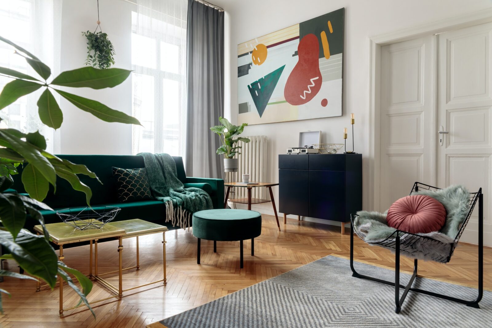 Luxury and modern home interior with design green sofa.